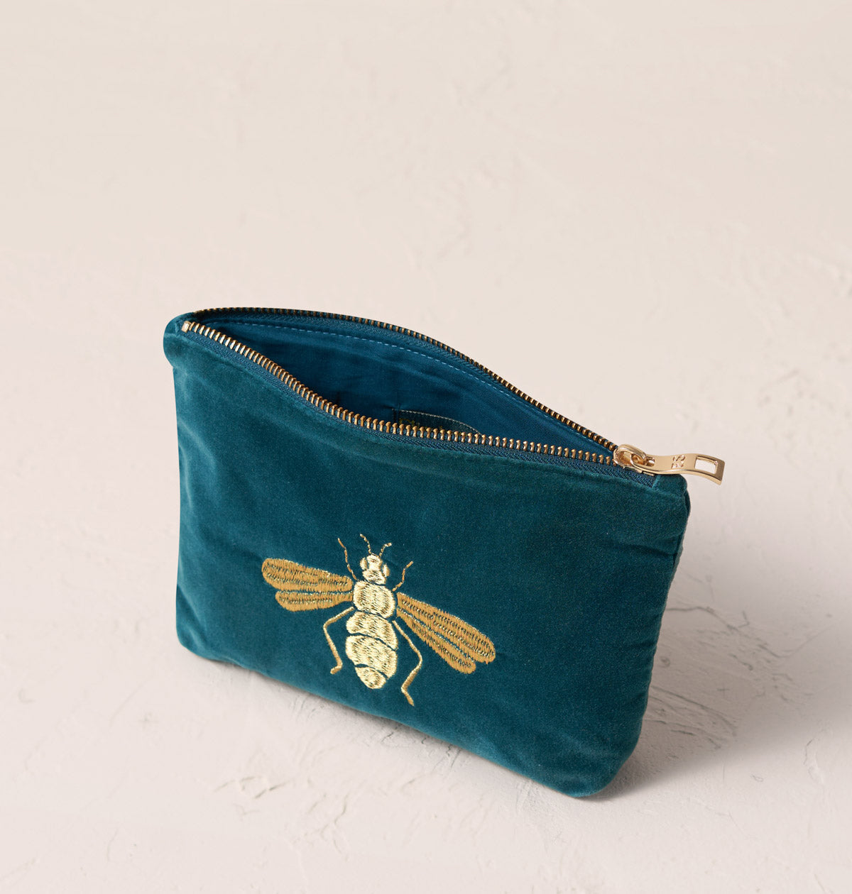 Elizabeth scarlett honey bee in rich blue mini pouch